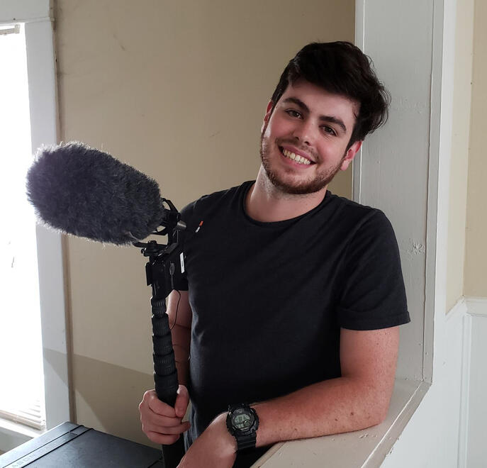 Boom operator pose after a long day of shooting a scene for "Start-Up" Photo by James Luce, 2018.